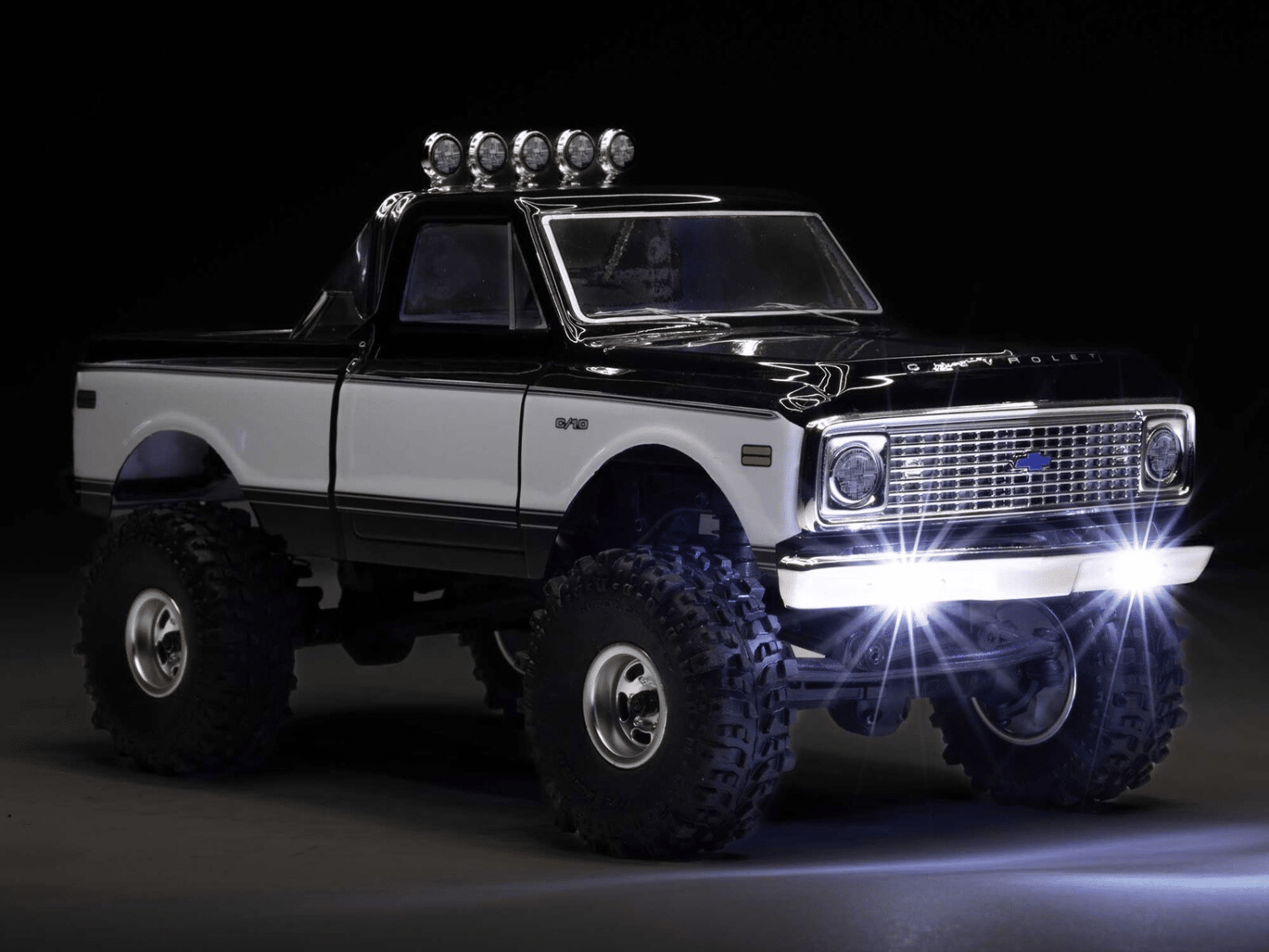 Axial SCX24 Chevy C10 lands May 6: Modular grille swaps and oil shocks aim to make this 1/24 RC crawler more capable