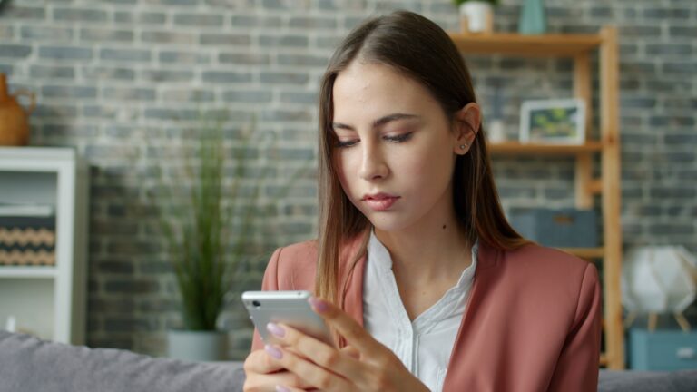 Woman updating phone