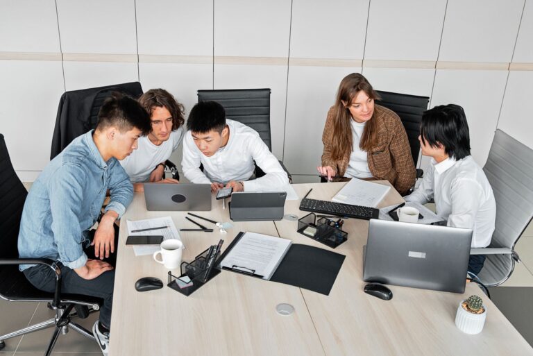 Team collaborating laptop