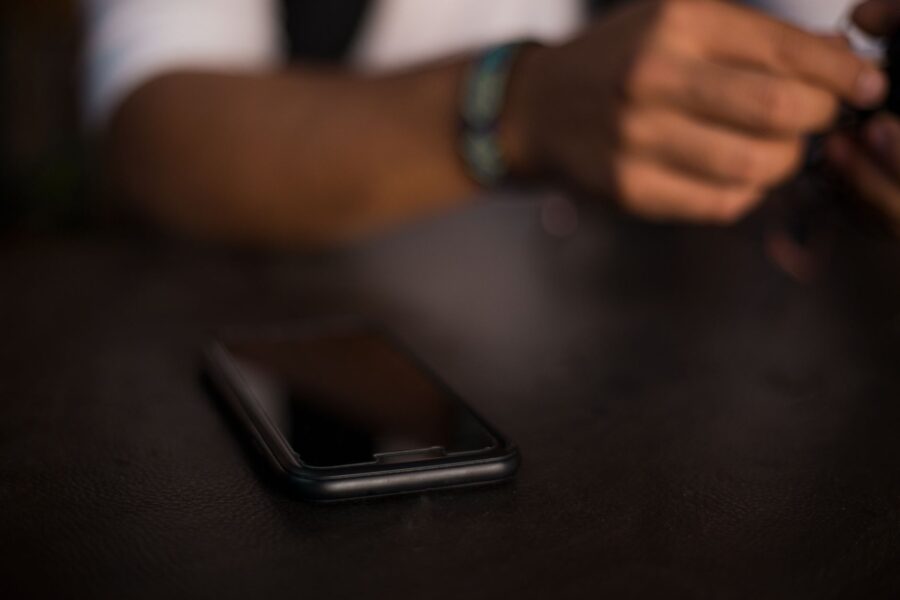 Person setting smartphone