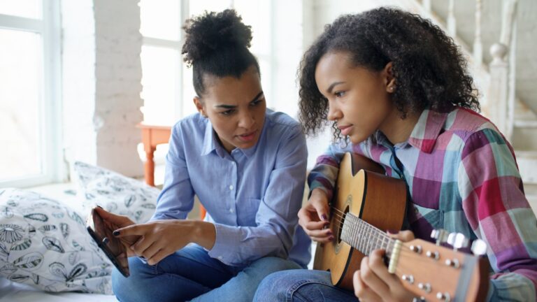 Guitar learner practicing