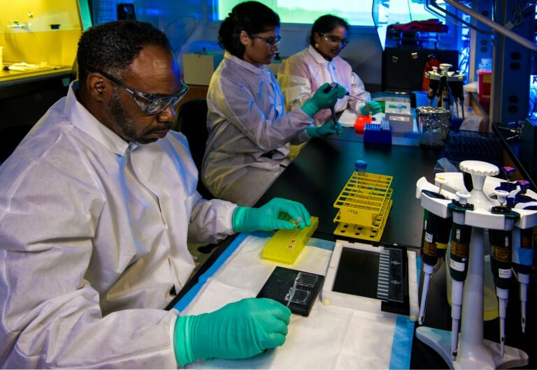 Laboratory scientists examining