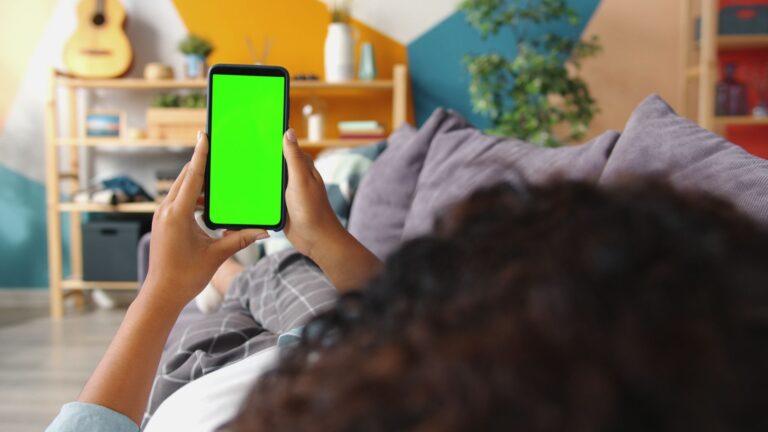 Person arranging smartphone